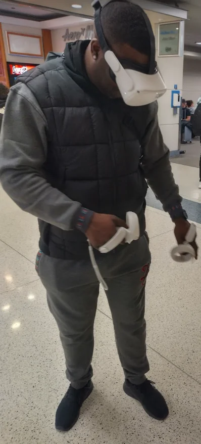 Adult participant using virtual reality controllers
