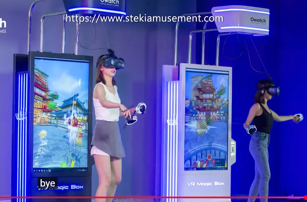 Owatch VR Magic Box kiosks with overhead headset support frames and people actively playing