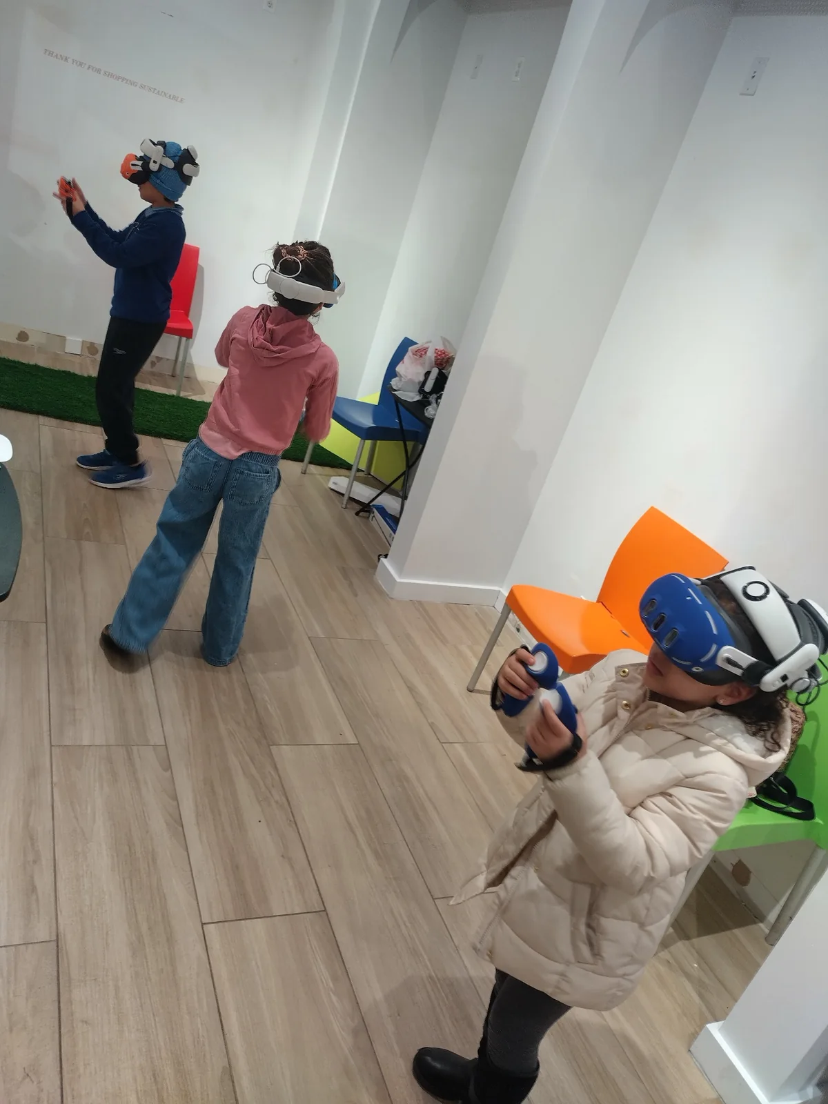 Multiple participants using virtual reality during an indoor pop-up activation